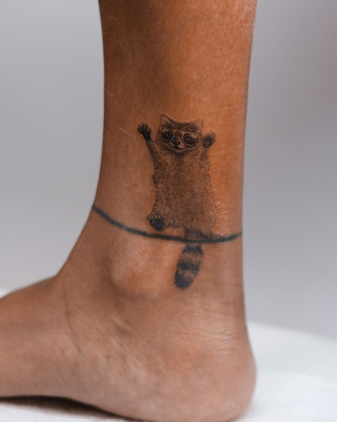 2026 tattoo trends microrealistic tattoos raccoon on ankle